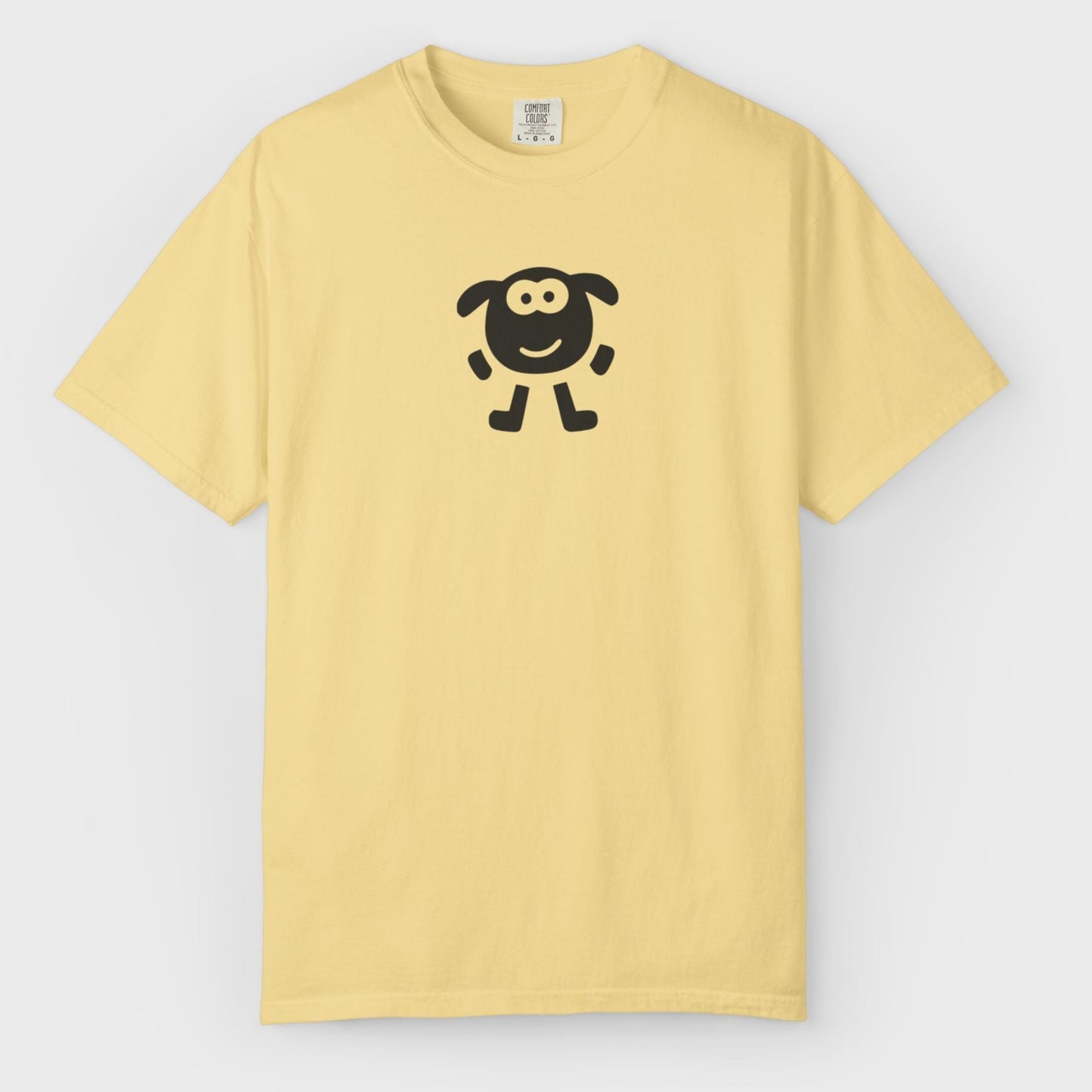 Yellow t-shirt with a black sheep design on a light gray background