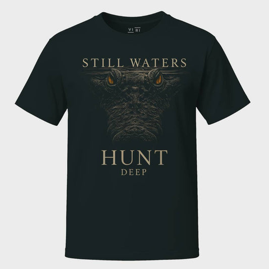 Black t-shirt with a graphic of a wolf's face and text 'STILL WATERS HUNT DEEP' on a white background